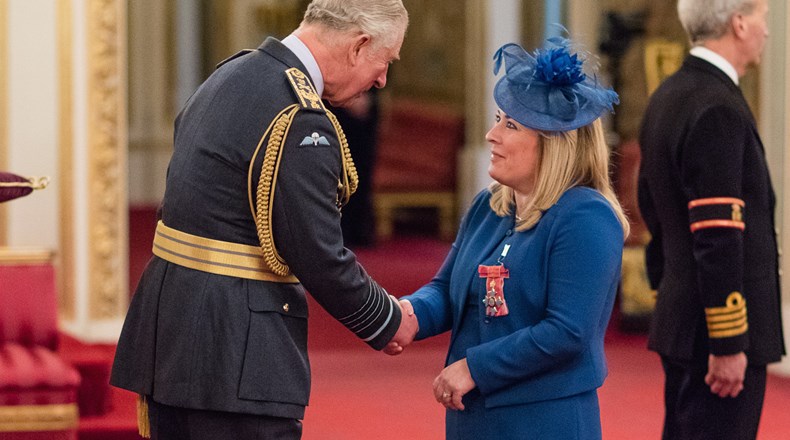 Lesley Powell receives her CBE from Prince Charles